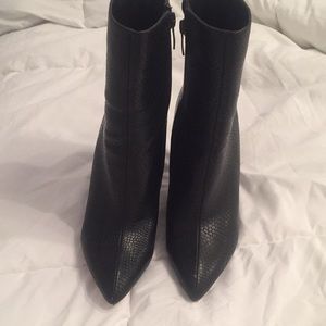 Pointy black faux leather booties